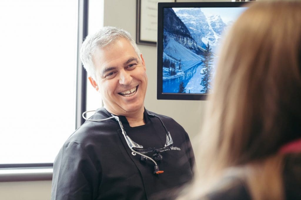 family-dental-centre-smiling-dentist-wearing-black