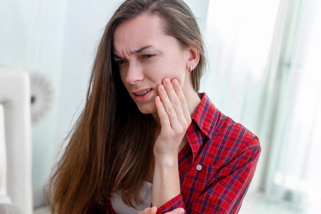 Young girl clenching teeth