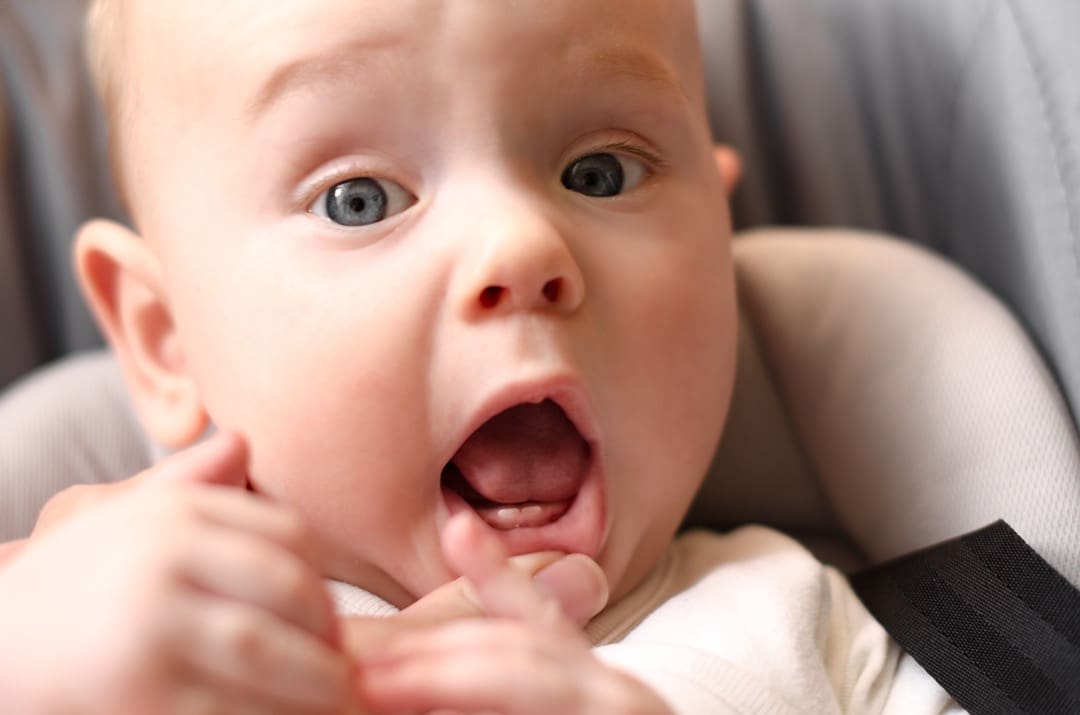 Baby with first teeth