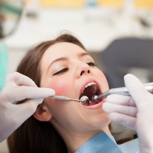 Dentist in Kelowna performing dental exam