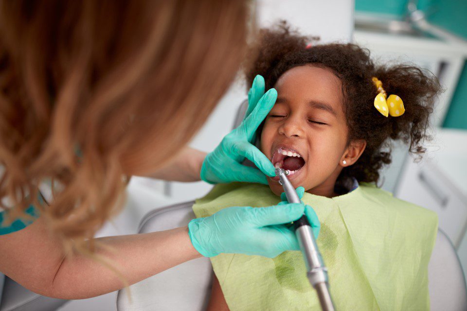 Child having cavity filled